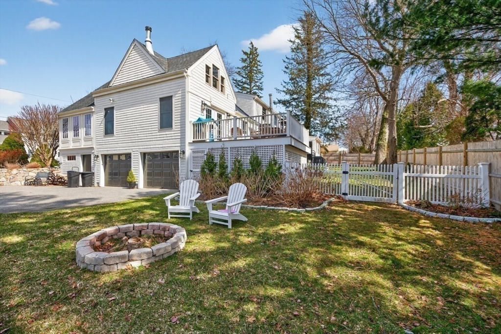12 Tupelo Road Cohasset, MA 02025 - Photo 31 of 35 a view of a house with backyard and sitting area