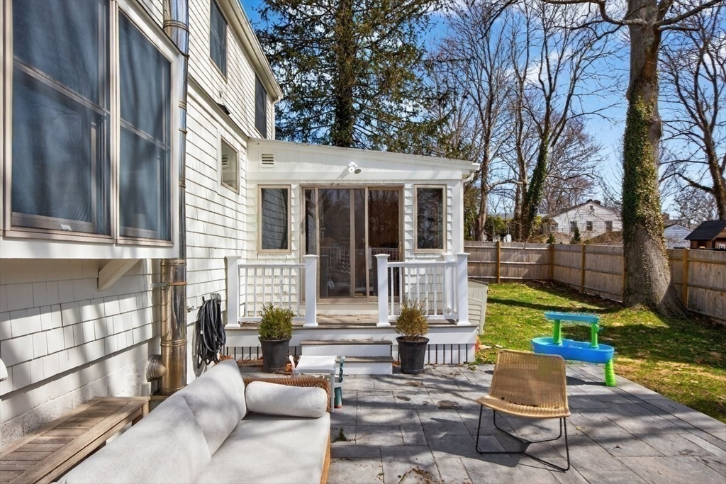12 Tupelo Road Cohasset, MA 02025 - Photo 33 of 35 a view of a patio with table and chairs potted plants and large tree
