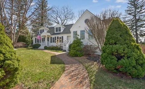 a kitchen with stainless steel appliances a stove refrigerator sink and cabinets