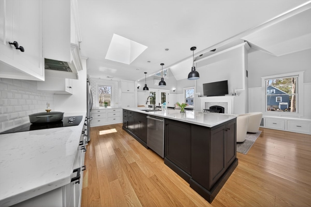12 Tupelo Road Cohasset, MA 02025 - Photo 7 of 35 a kitchen with stainless steel appliances a sink dishwasher stove and oven with wooden floor