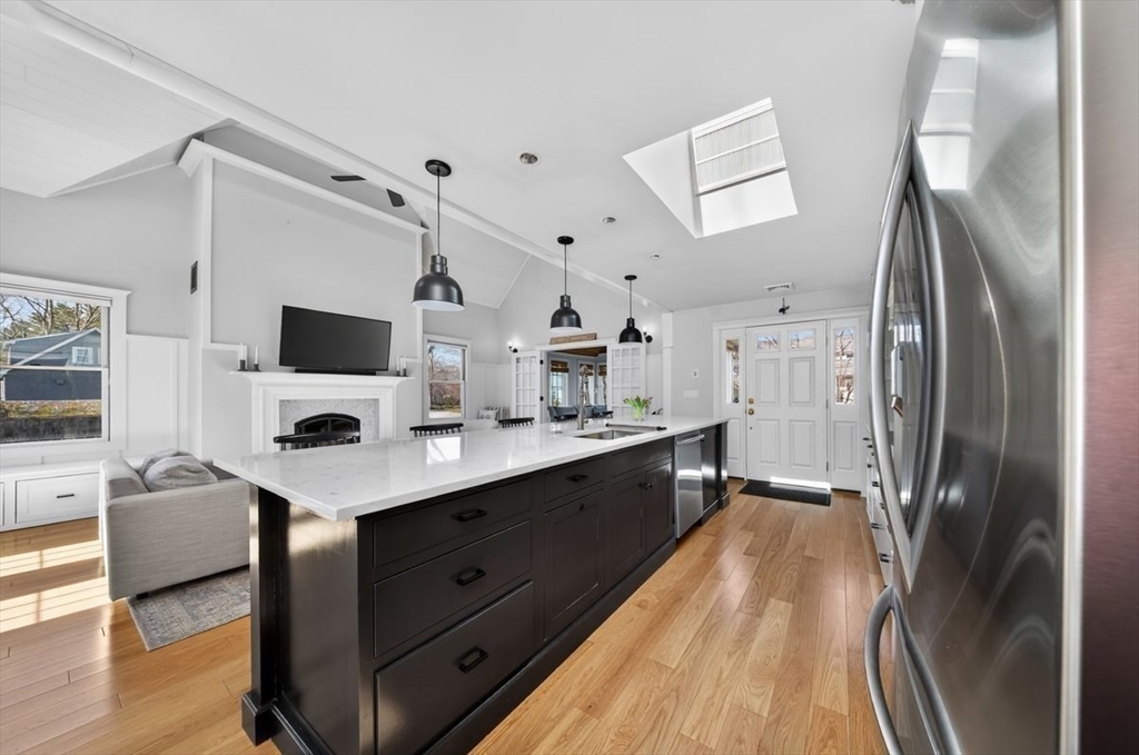 12 Tupelo Road Cohasset, MA 02025 - Photo 10 of 35 a kitchen with stainless steel appliances a refrigerator sink and wooden floor