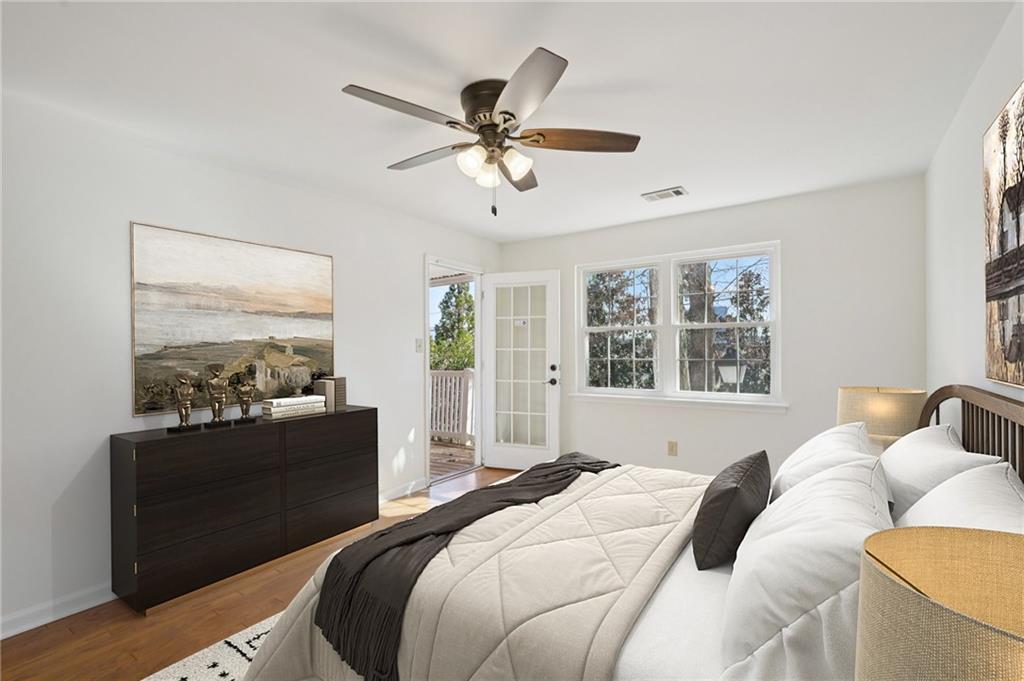 1750 Clairmont Road, Unit 21 Decatur, GA 30033 - Photo 13 of 23 a bedroom with a bed and a chandelier