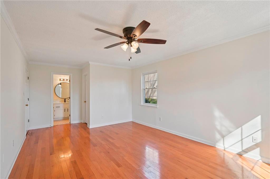 1750 Clairmont Road, Unit 21 Decatur, GA 30033 - Photo 15 of 23 a bedroom with a bed and a chandelier