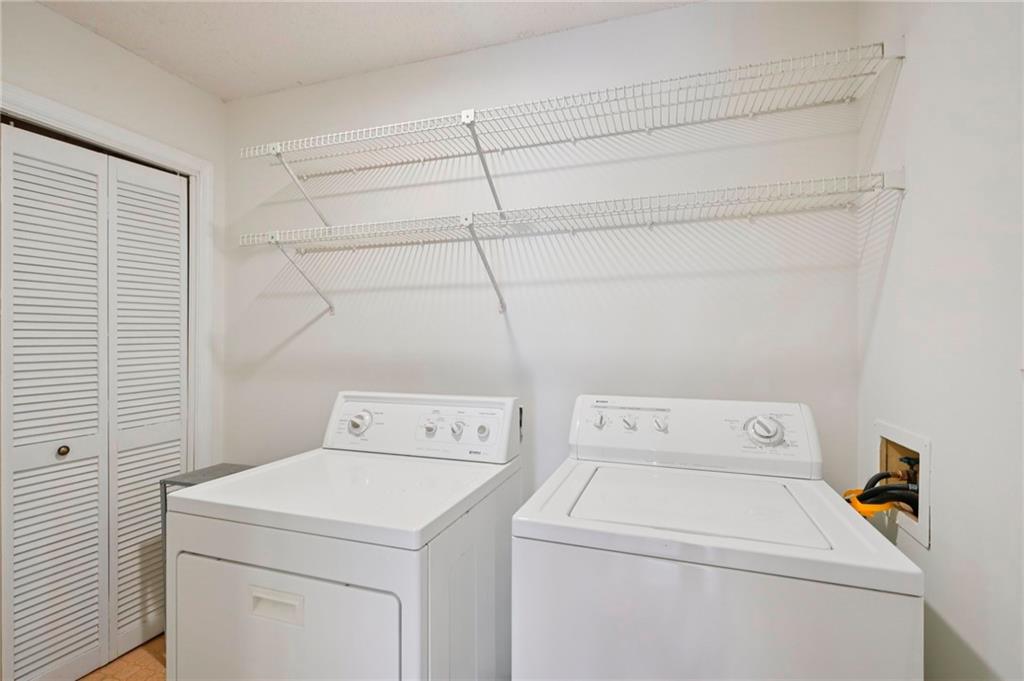 1750 Clairmont Road, Unit 21 Decatur, GA 30033 - Photo 17 of 23 a utility room with dryer and washer