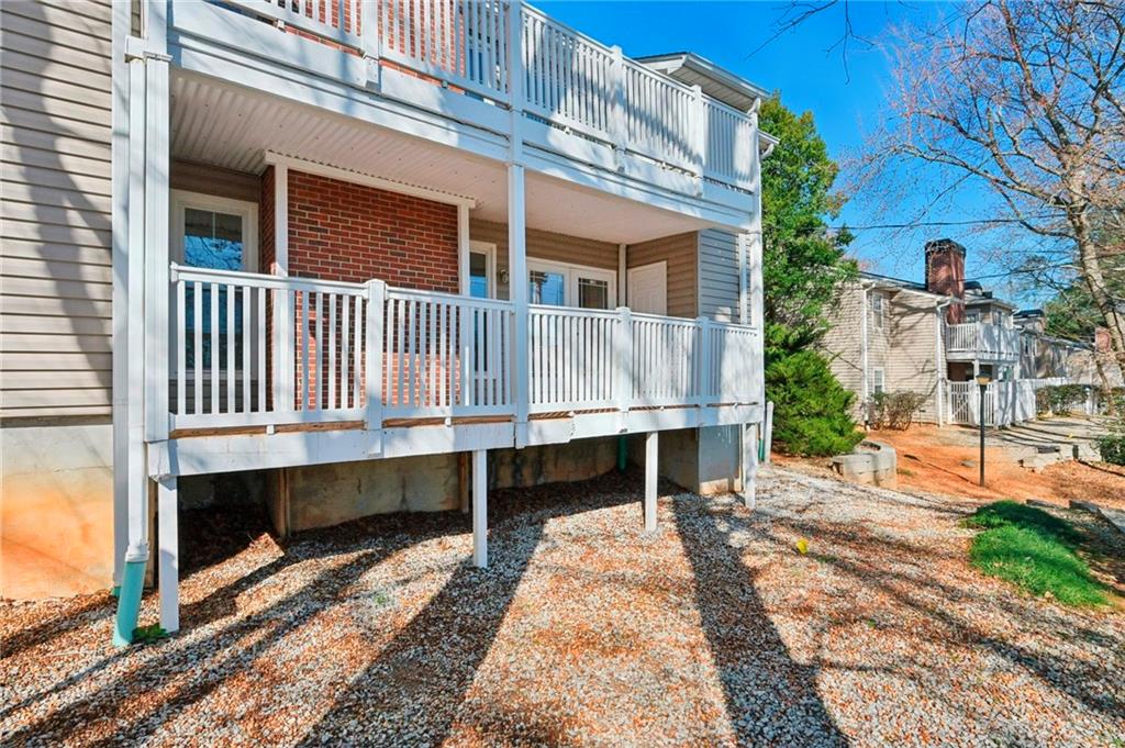 1750 Clairmont Road, Unit 21 Decatur, GA 30033 - Photo 19 of 23 a front view of a house with a yard