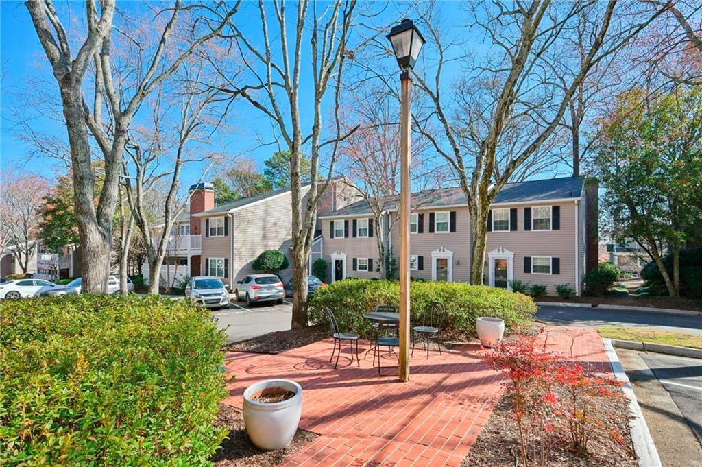 1750 Clairmont Road, Unit 21 Decatur, GA 30033 - Photo 22 of 23 a front view of a house with garden view and tree