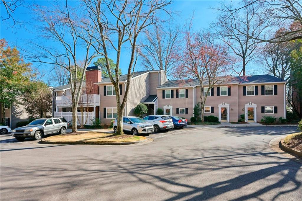 1750 Clairmont Road, Unit 21 Decatur, GA 30033 - Photo 23 of 23 a view of a parked cars in front of a building