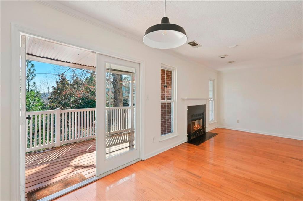1750 Clairmont Road, Unit 21 Decatur, GA 30033 - Photo 6 of 23 a view of a livingroom with wooden floor and a fireplace