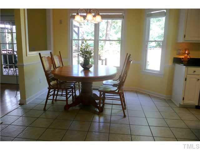 5116 Salem Ridge Road Holly Springs, NC 27540 - Photo 12 of 25 The spacious breakfast area has lovely views of the backyard and golf course and opens to both the sunroom and the kitchen. Breakfast Area