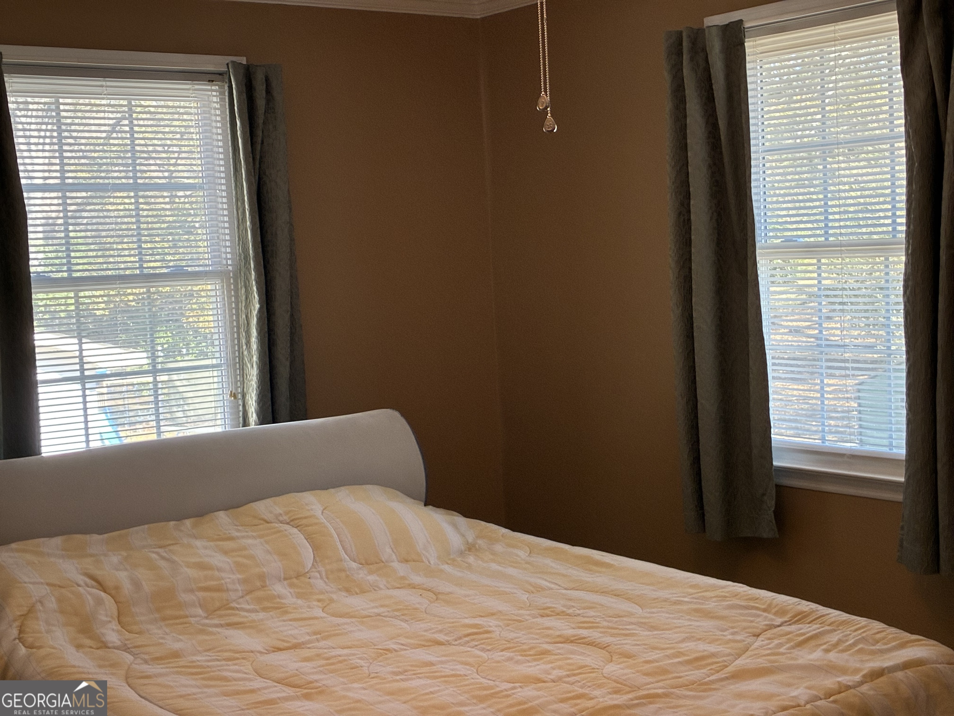 3491 Sandy Circle Macon, GA 31216 - Photo 20 of 49 a bed sitting in a bedroom next to a window
