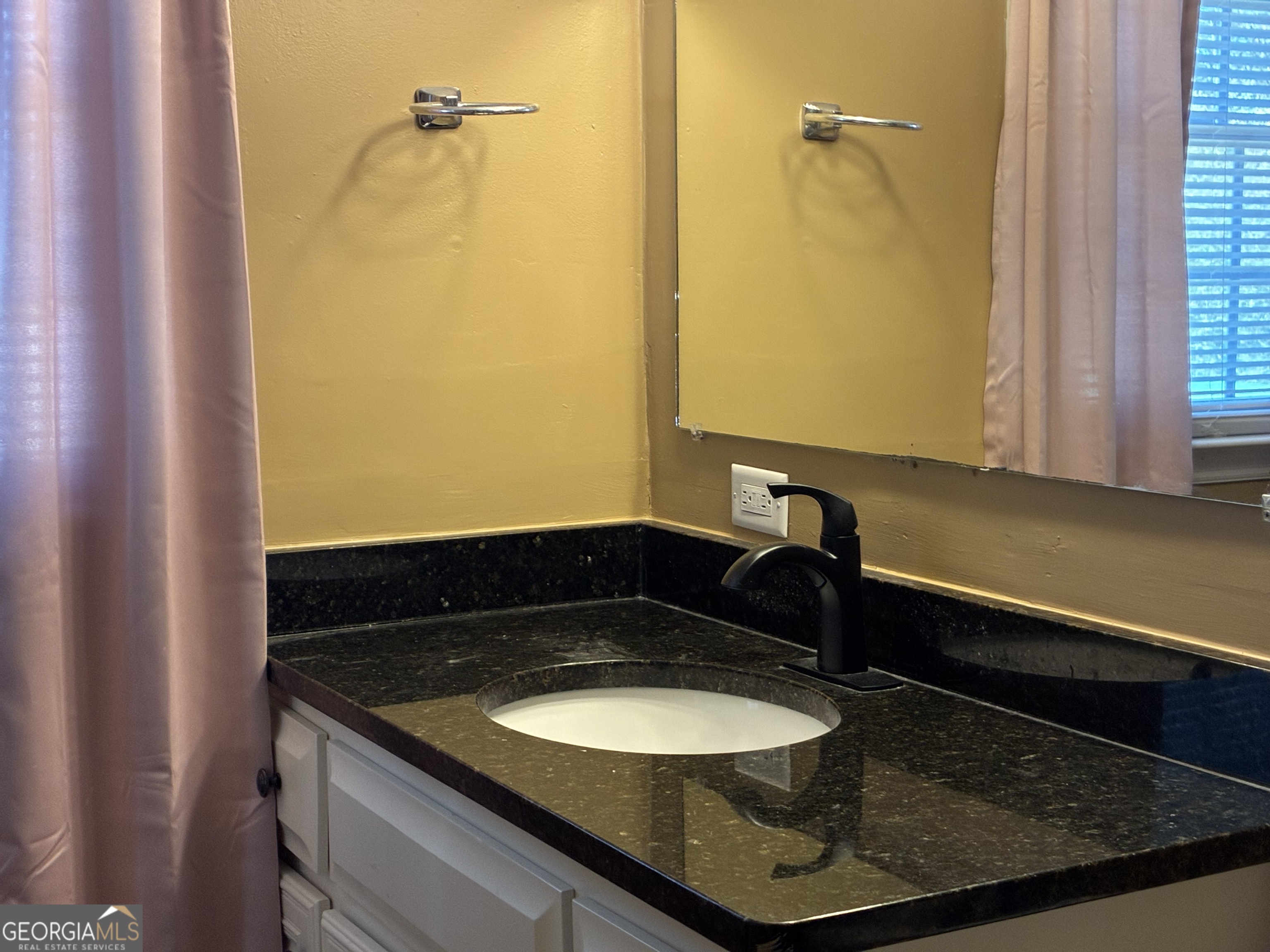3491 Sandy Circle Macon, GA 31216 - Photo 30 of 49 a bathroom with a granite countertop sink and a mirror