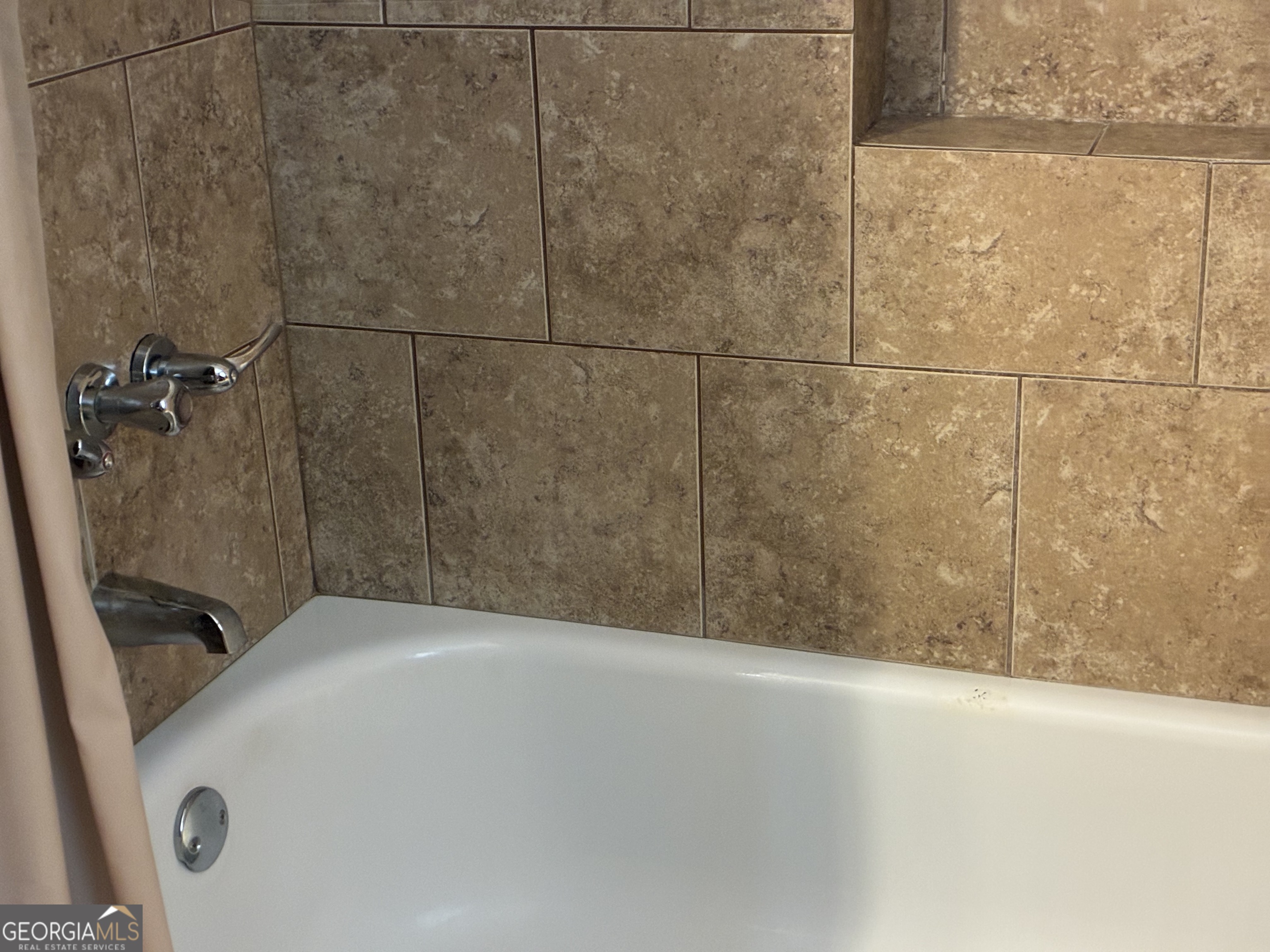 3491 Sandy Circle Macon, GA 31216 - Photo 34 of 49 a bathroom with a bathtub