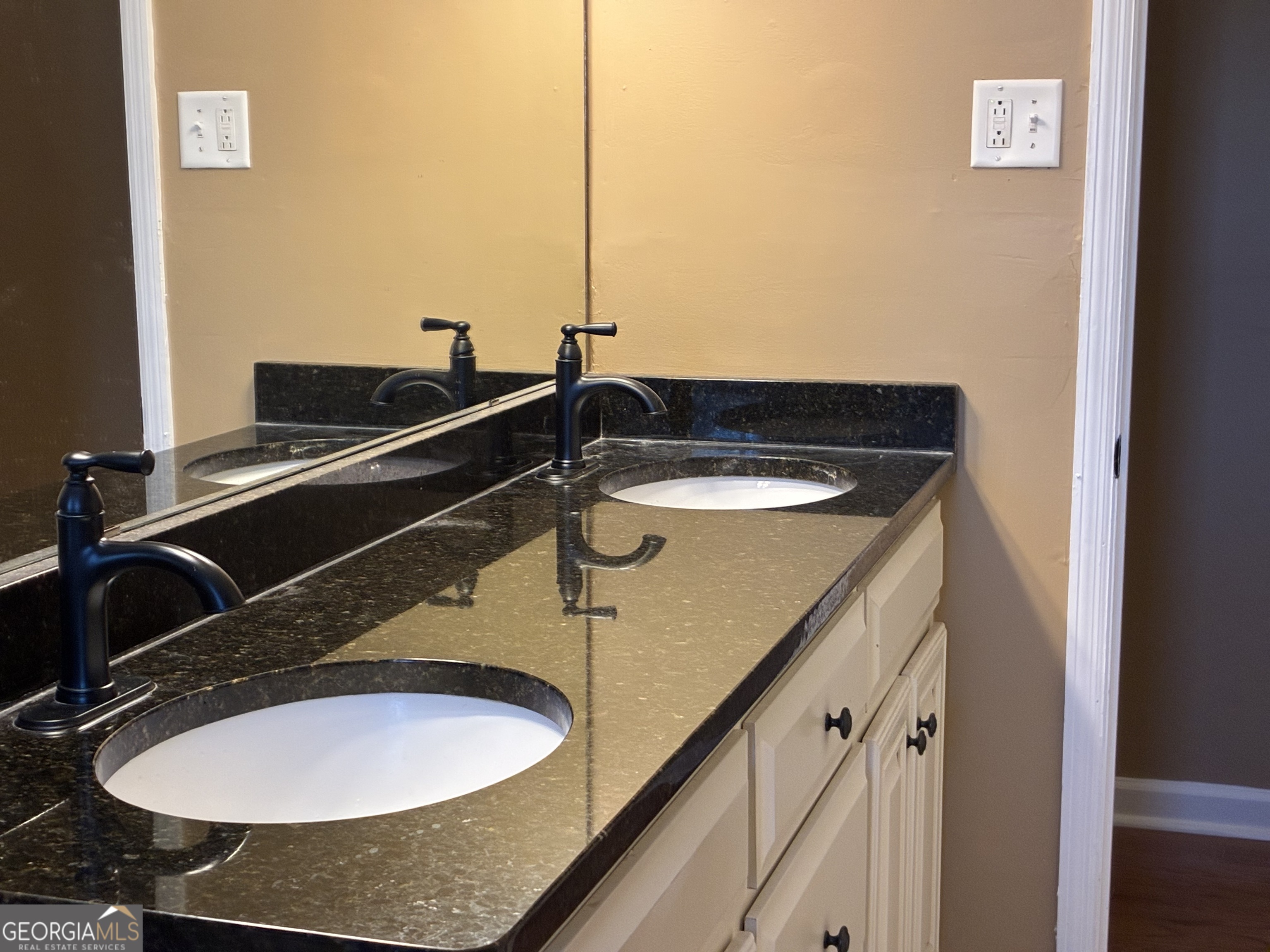 3491 Sandy Circle Macon, GA 31216 - Photo 37 of 49 a bathroom with a sink and a mirror