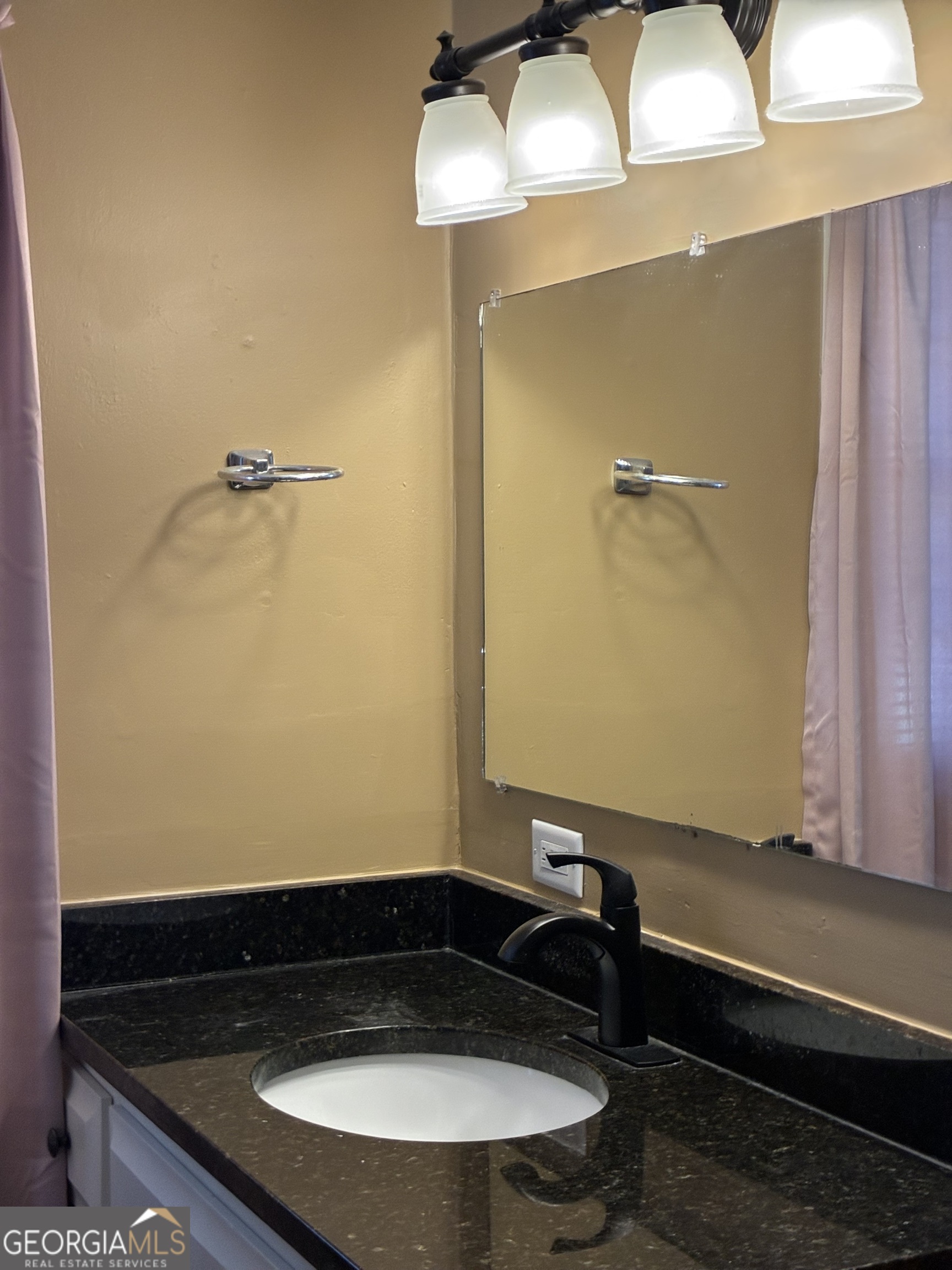 3491 Sandy Circle Macon, GA 31216 - Photo 38 of 49 a bathroom with a sink and a mirror