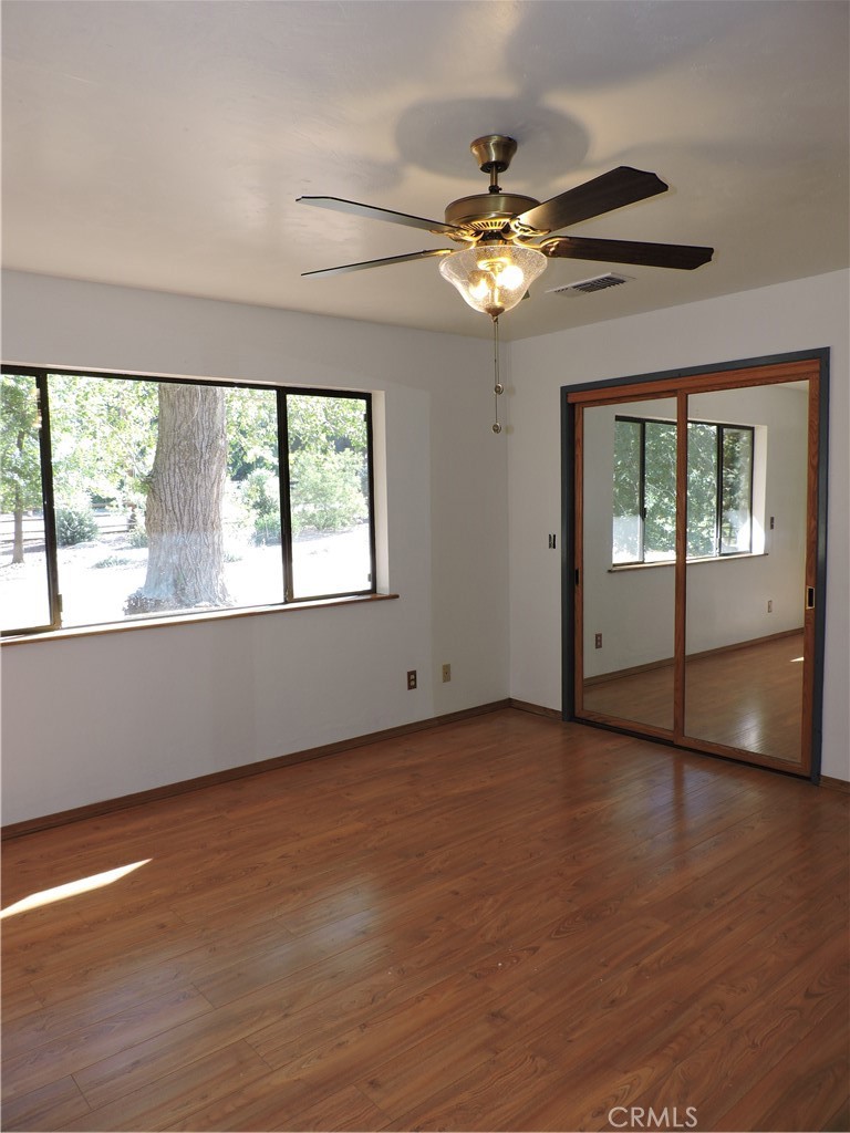 26931 Columbia Way Tehachapi, CA 93561 - Photo 45 of 49 Primary Bedroom has large closet with mirrored doors.