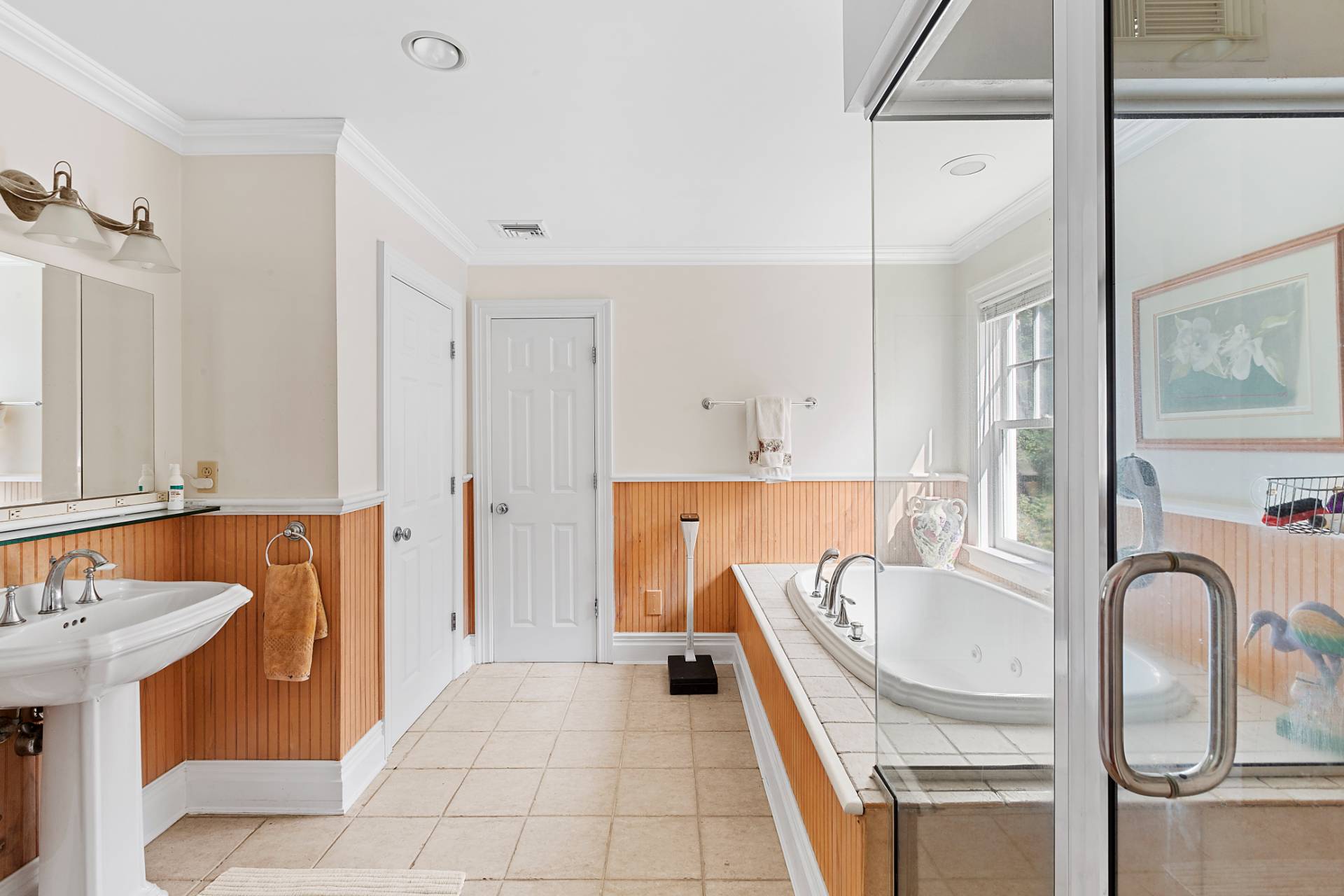 22 Deerwood Path Sag Harbor, NY 11963 - Photo 12 of 18 a bath room with a sink and a bath tub