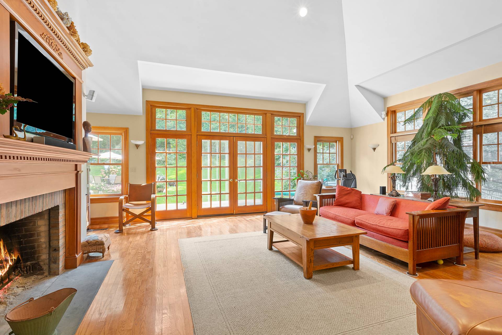 22 Deerwood Path Sag Harbor, NY 11963 - Photo 6 of 18 a living room with fireplace furniture and a flat screen tv