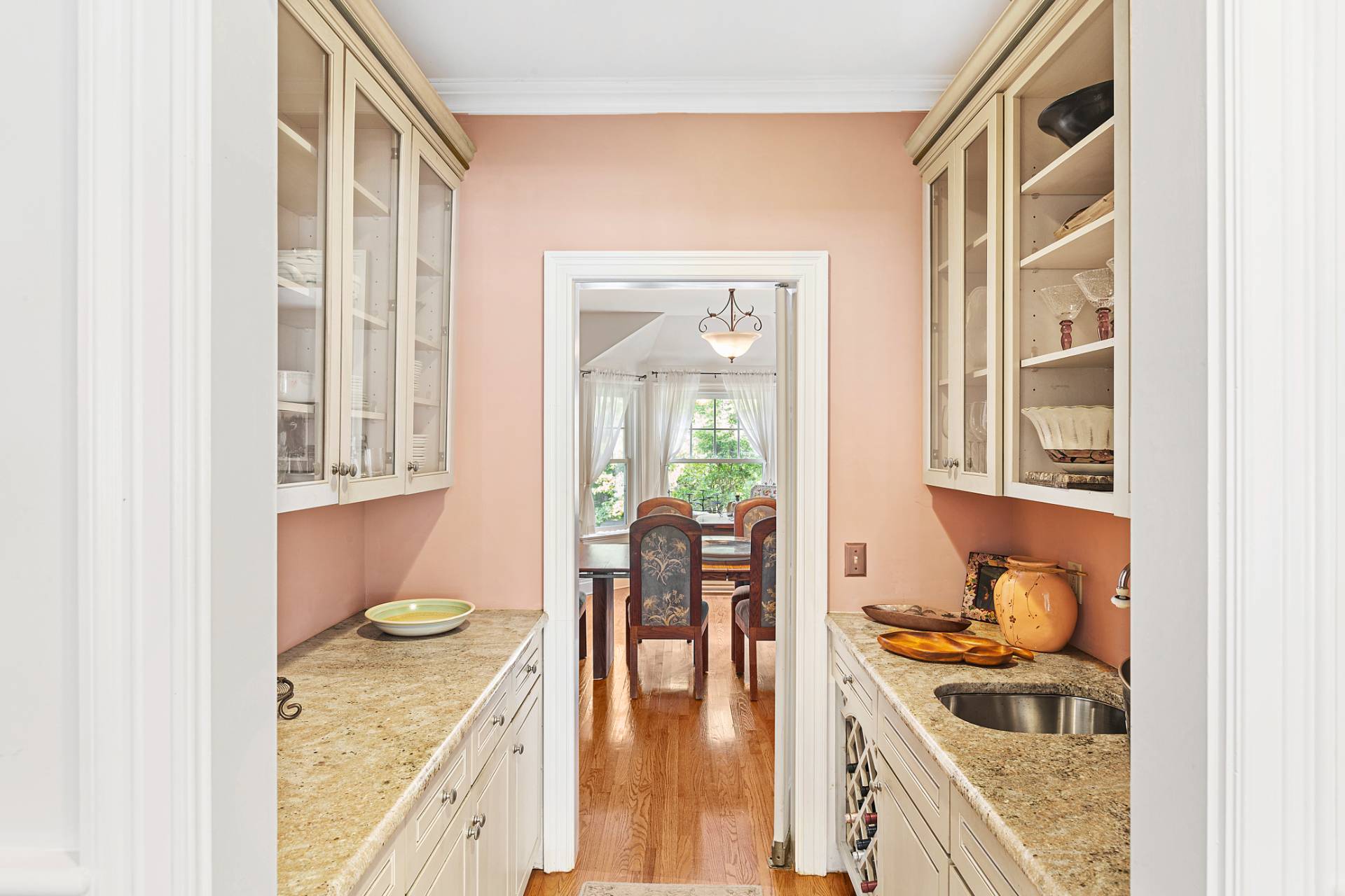 22 Deerwood Path Sag Harbor, NY 11963 - Photo 9 of 18 a kitchen with a sink and chairs