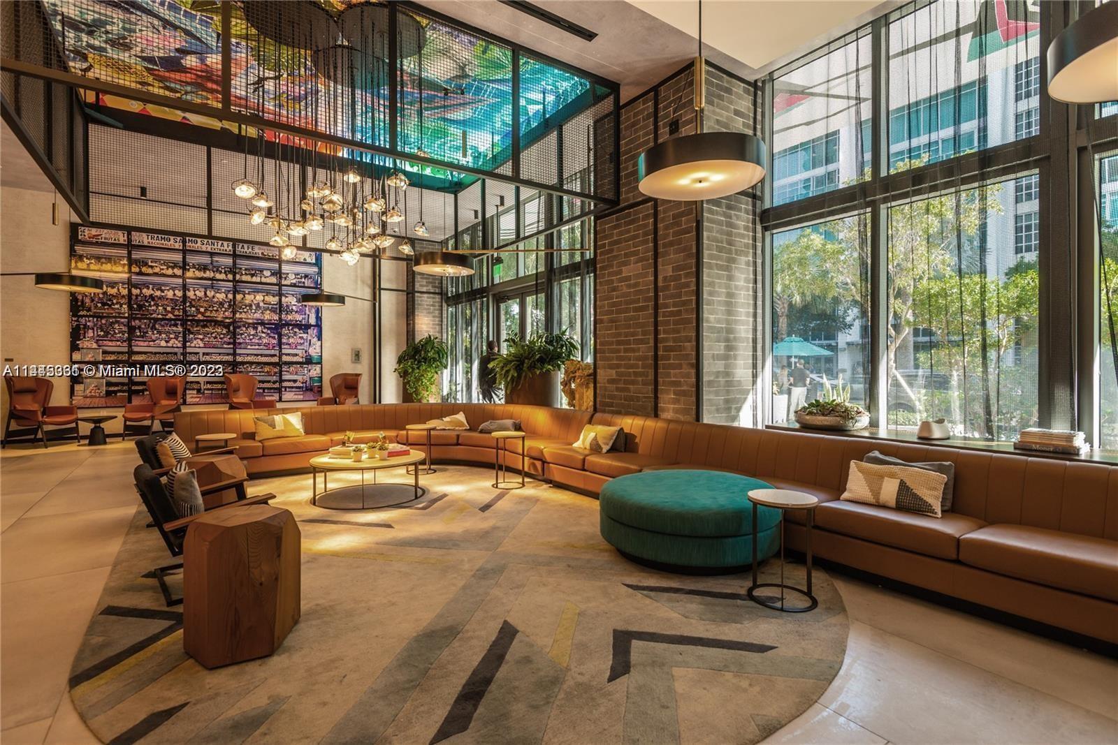 Midtown Miami Miami, FL 33137 - Photo 6 of 14 a living room with furniture and a large window