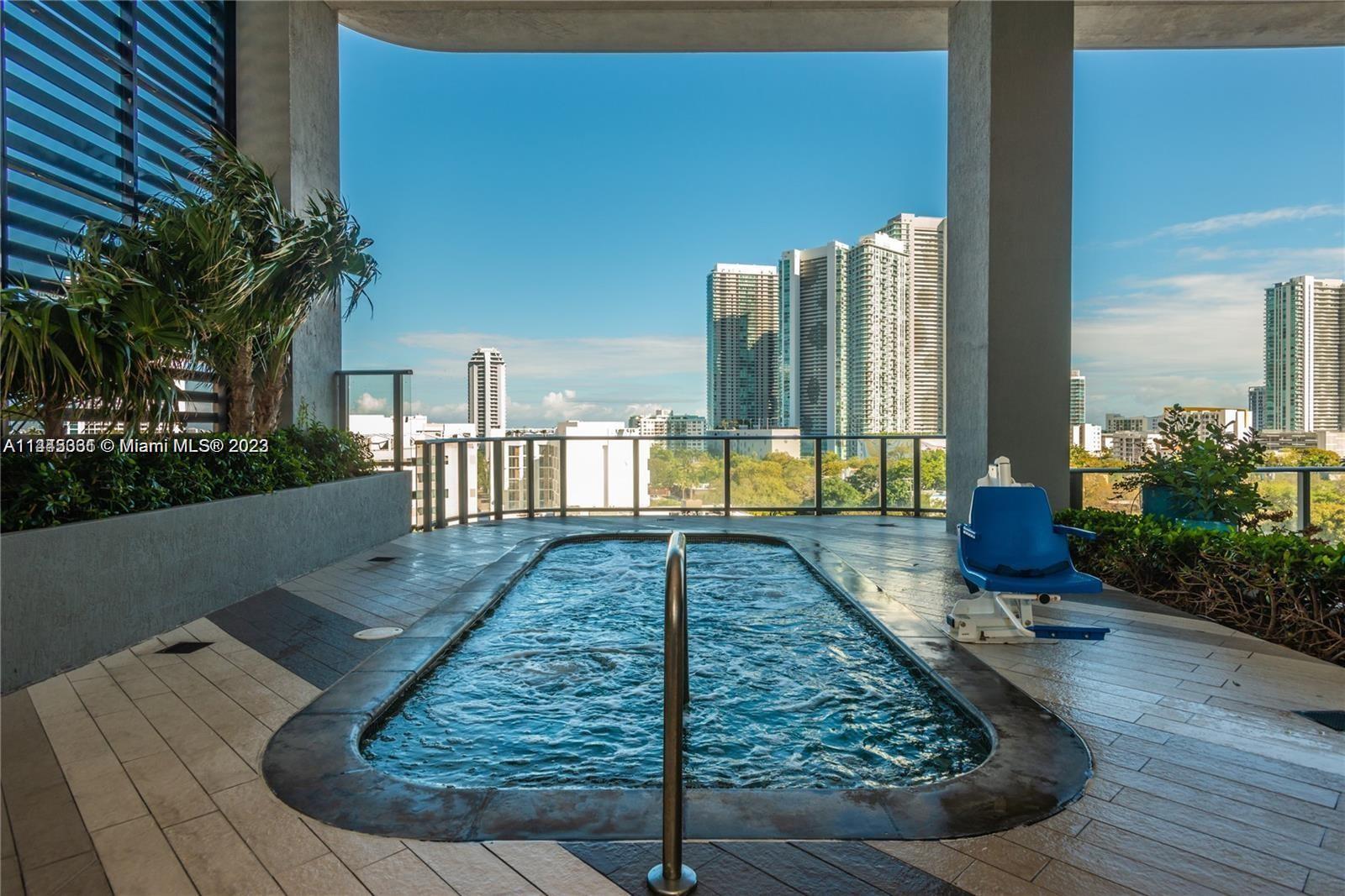 Midtown Miami Miami, FL 33137 - Photo 10 of 14 a view of a backyard with sitting area