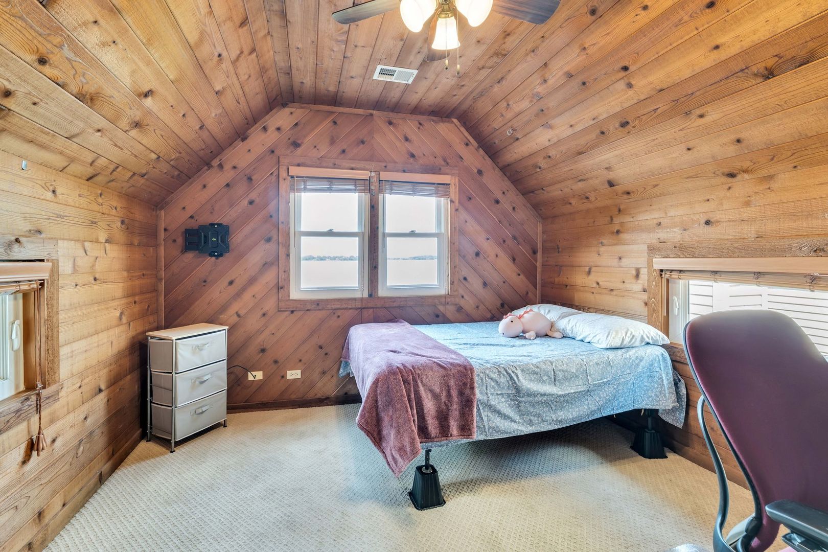 4018 Pitzen Road Johnsburg, IL 60051 - Photo 22 of 47 a bedroom with a bed dresser and a window