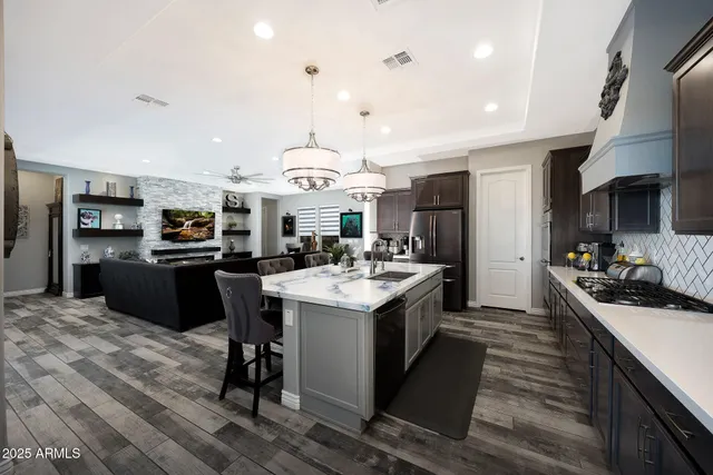 a kitchen with a stove a refrigerator and a refrigerator