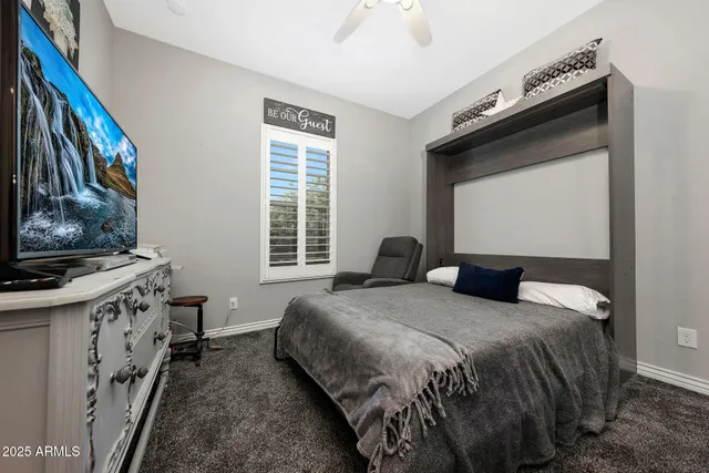 a bathroom with a double vanity sink toilet and a mirror