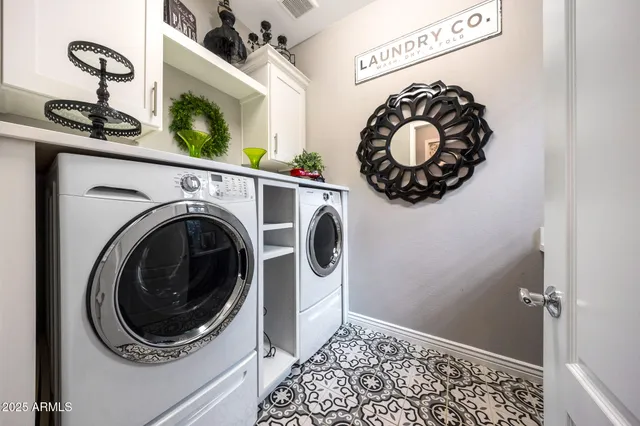 a living room with furniture potted plant and a large window