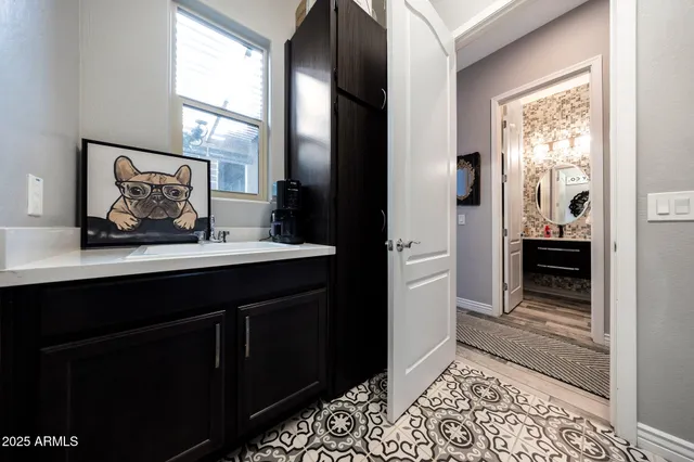 a view of a house with backyard sitting area and swimming pool