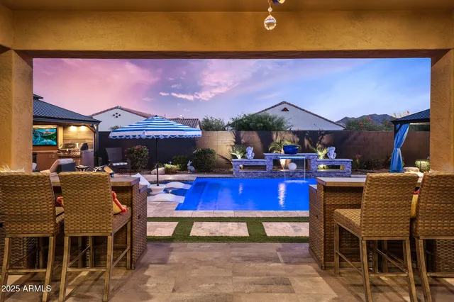 a view of a chairs and table in a patio