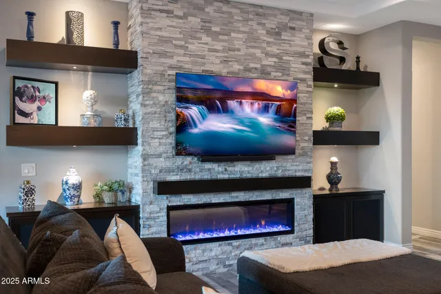 a living room with furniture and a fireplace