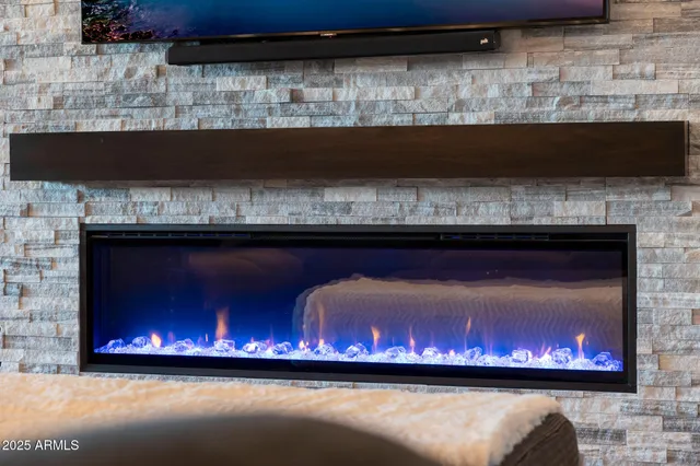 a view of fireplace with wooden floor