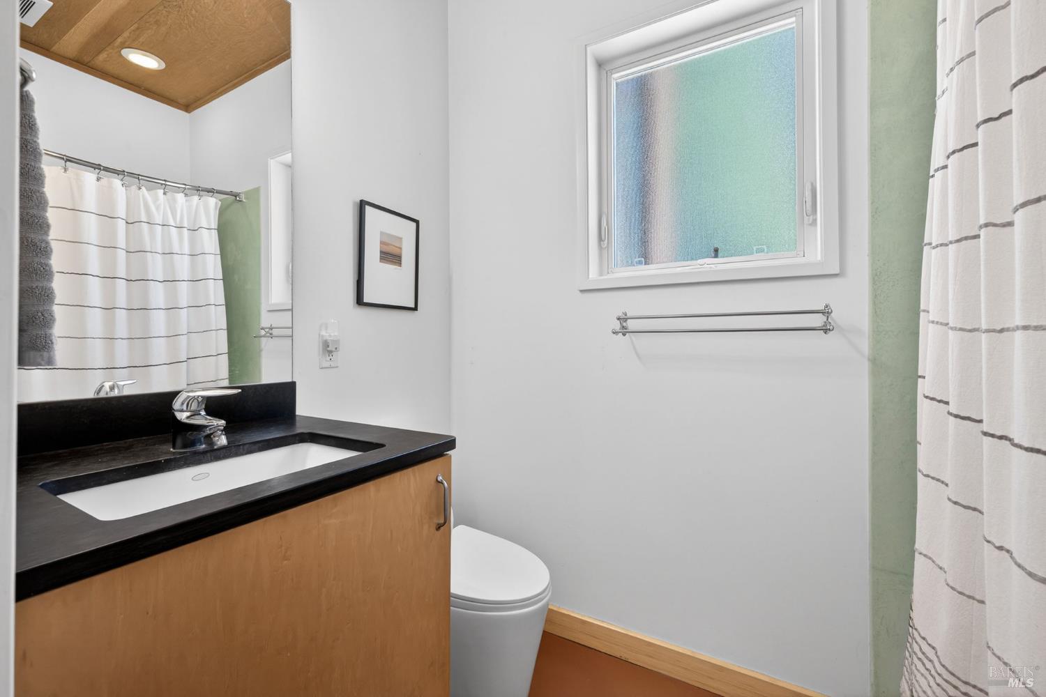 471 Florence Avenue Sebastopol, CA 95472 - Photo 11 of 71 The downstairs offers a full bathroom, with low-flow toilet/fixtures and shower/tub combo.