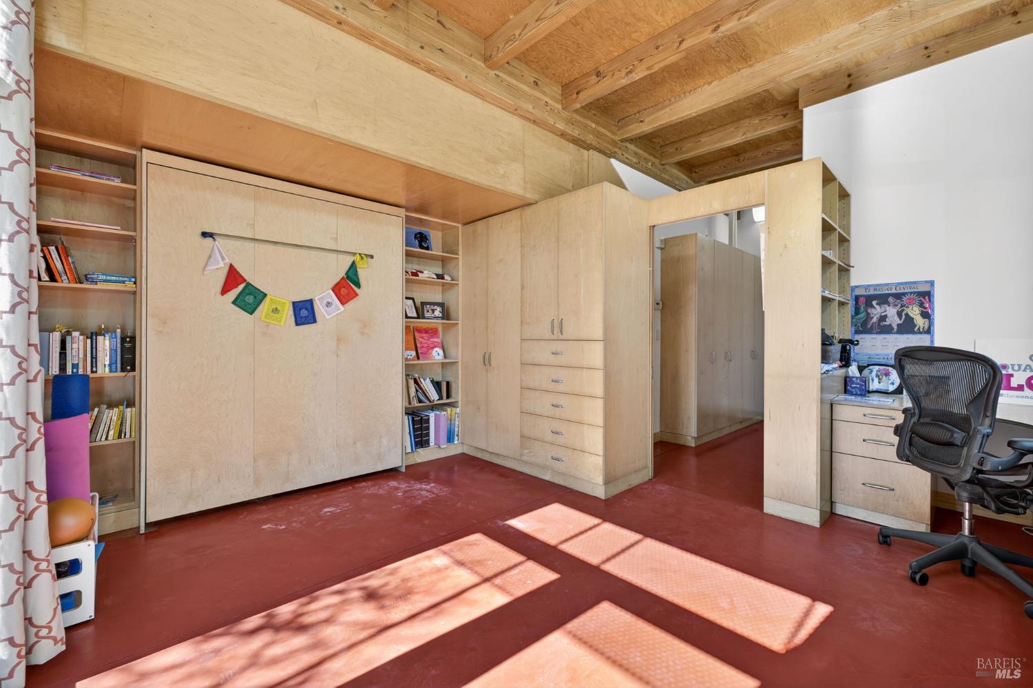 471 Florence Avenue Sebastopol, CA 95472 - Photo 13 of 71 This space currently is utilized as a home office / guest room, with a murphy bed and plenty of built-ins!