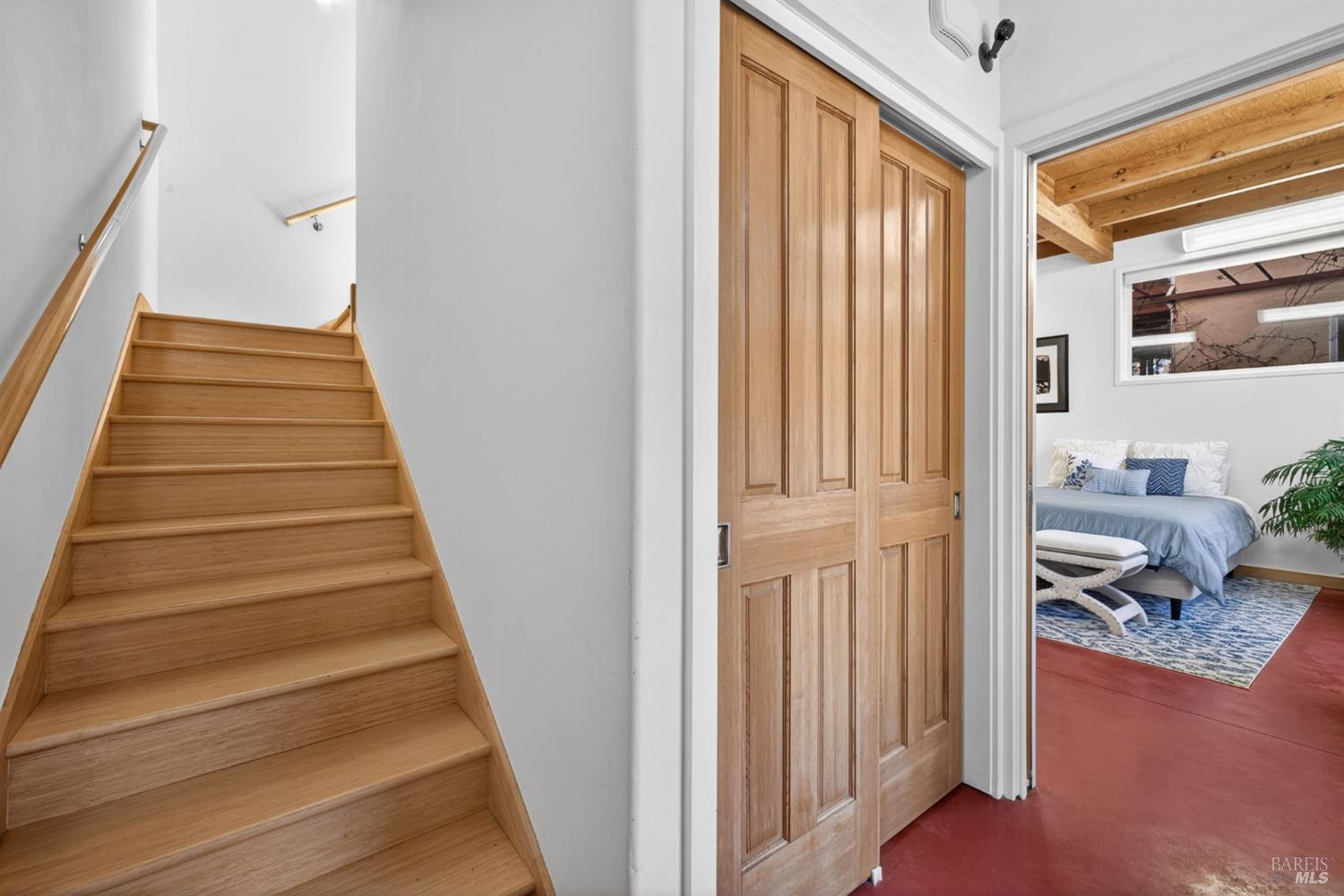 471 Florence Avenue Sebastopol, CA 95472 - Photo 20 of 71 The entry, with coat closet, access to the downstairs, and bamboo stairs up to the second floor.