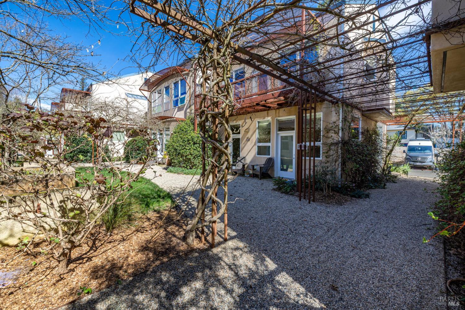 471 Florence Avenue Sebastopol, CA 95472 - Photo 44 of 71 Walkway along the right side of the house takes you to the parking area.