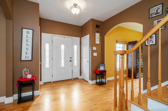 a view of living room with wooden floor and furniture