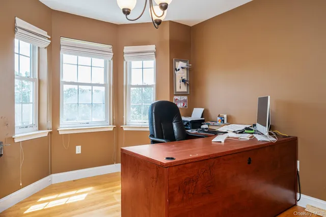 a workspace with furniture and window