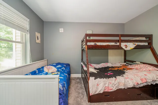 a room that has a bed and a window