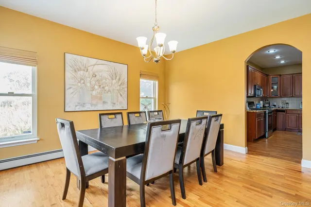 a dining room with furniture and window