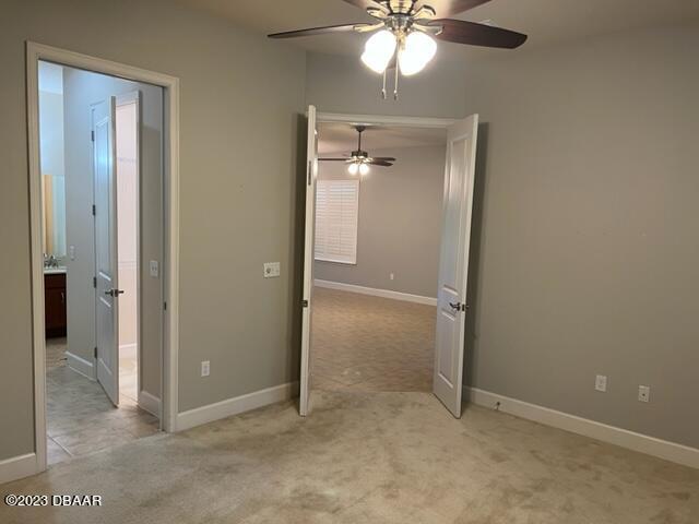 742 Aldenham Lane Ormond Beach, FL 32174 - Photo 16 of 25 an empty room with fan and entrance