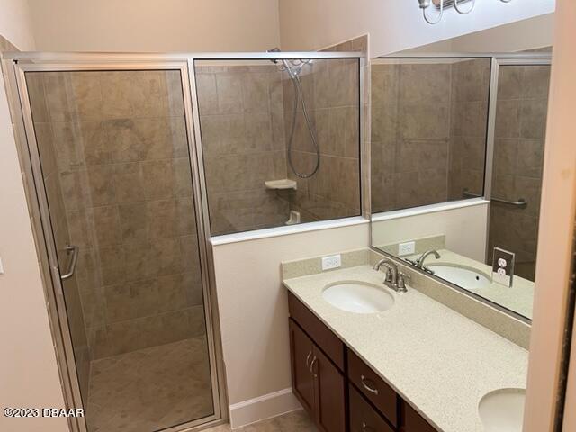 742 Aldenham Lane Ormond Beach, FL 32174 - Photo 18 of 25 a bathroom with a shower sink and mirror