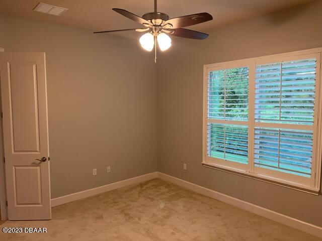 742 Aldenham Lane Ormond Beach, FL 32174 - Photo 22 of 25 a view of a room with a window and a ceiling fan