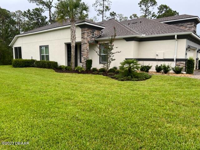 742 Aldenham Lane Ormond Beach, FL 32174 - Photo 24 of 25 a view of a house with garden