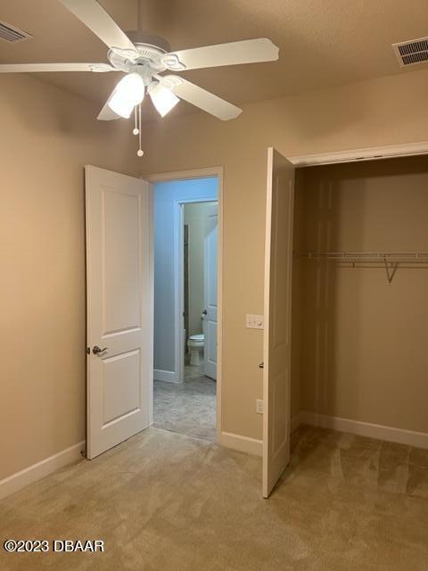 742 Aldenham Lane Ormond Beach, FL 32174 - Photo 10 of 25 an empty room with closet and a ceiling fan