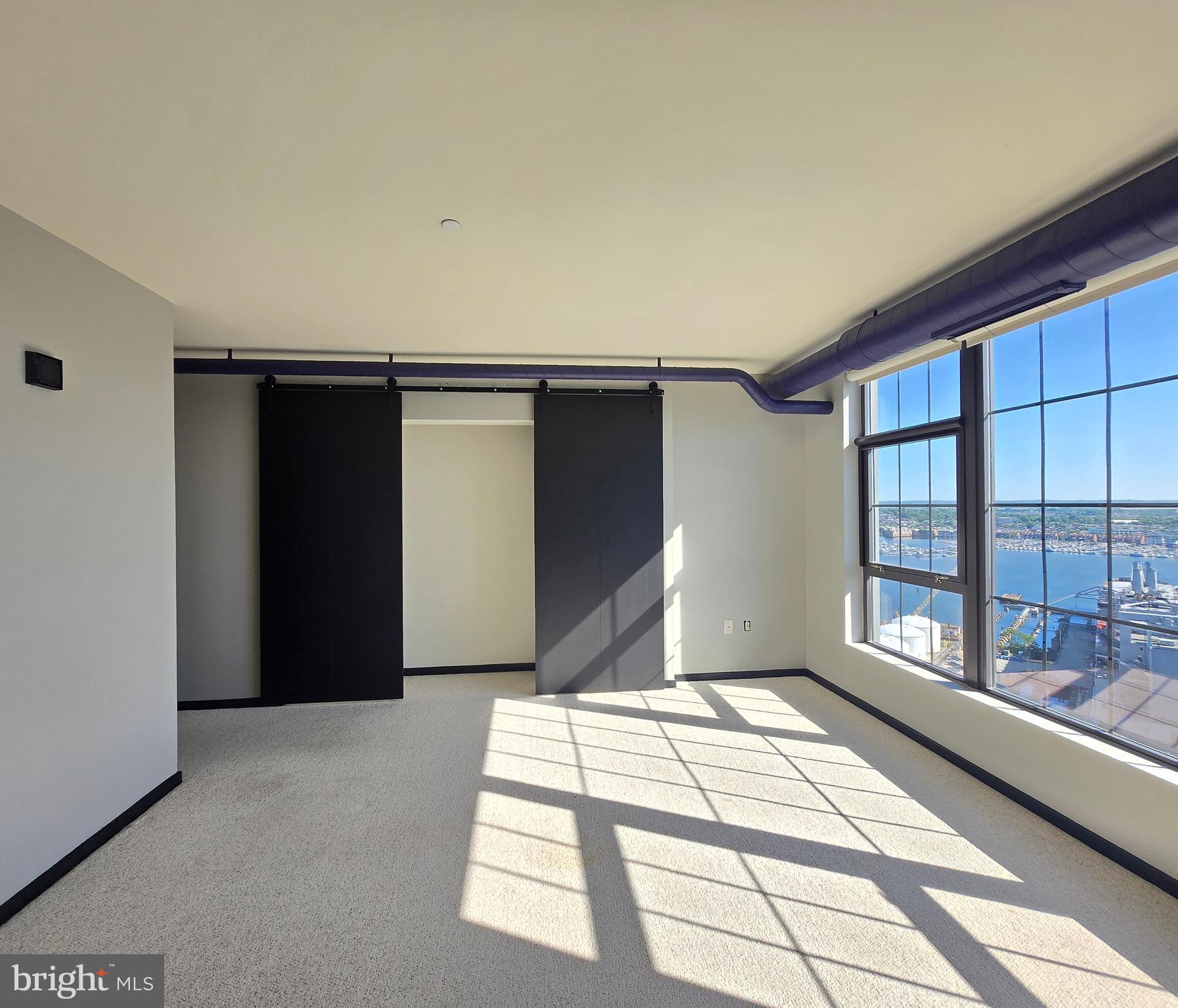 1200 Steuart Street, Unit 1913 Baltimore, MD 21230 - Photo 29 of 57 Sunlit secondary suite.