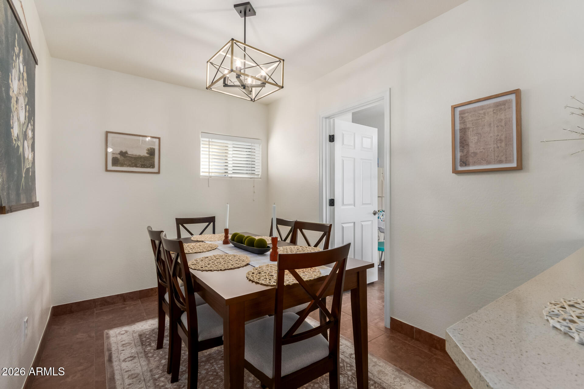 2715 West Royal Palm Road Phoenix, AZ 85051 - Photo 11 of 32 a view of a dining room with furniture and wooden floor