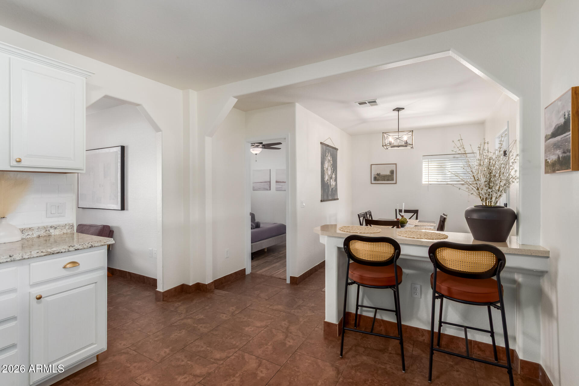 2715 West Royal Palm Road Phoenix, AZ 85051 - Photo 12 of 32 a view of a kitchen area and dining room