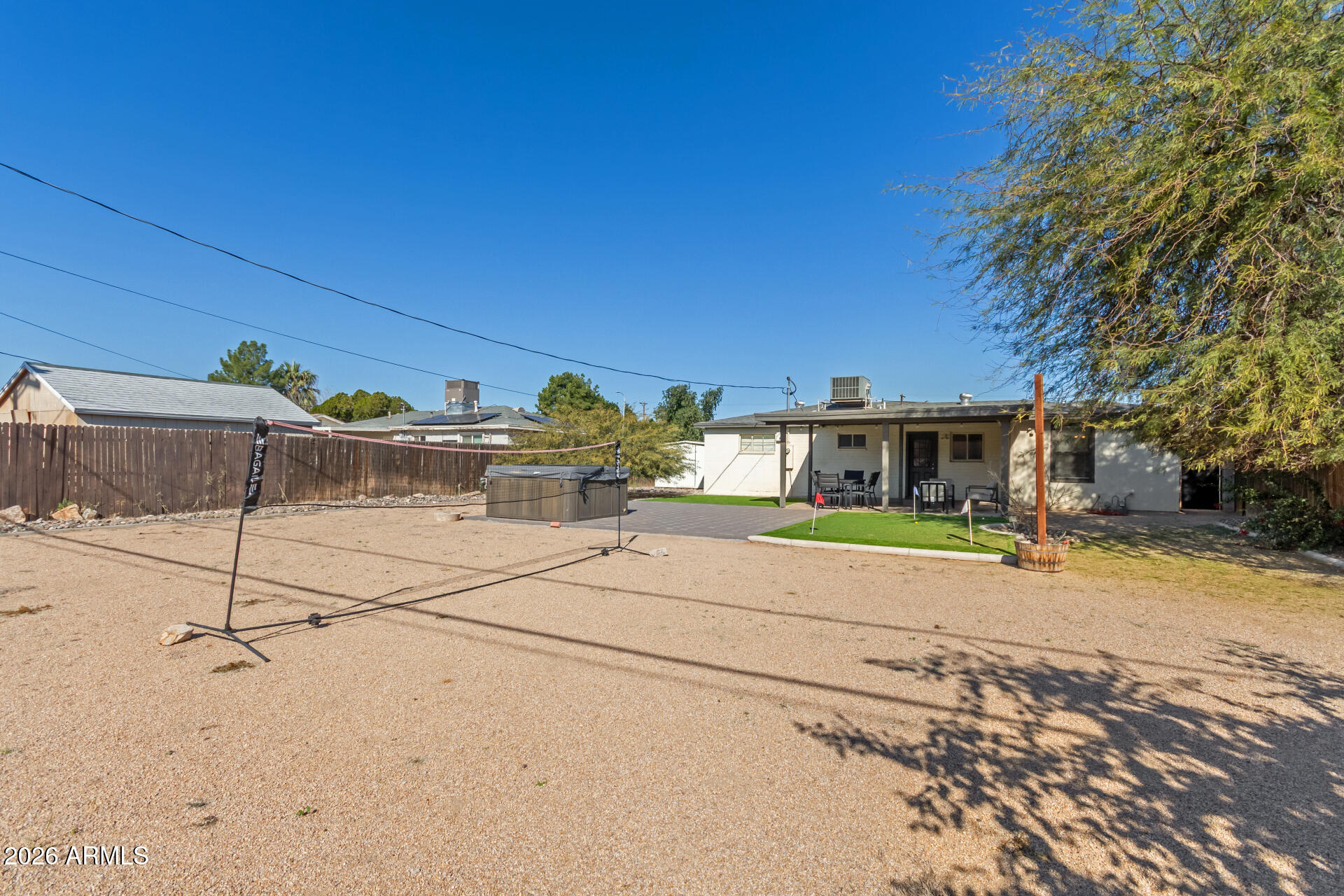 2715 West Royal Palm Road Phoenix, AZ 85051 - Photo 30 of 32 a front view of a house with a yard and garage