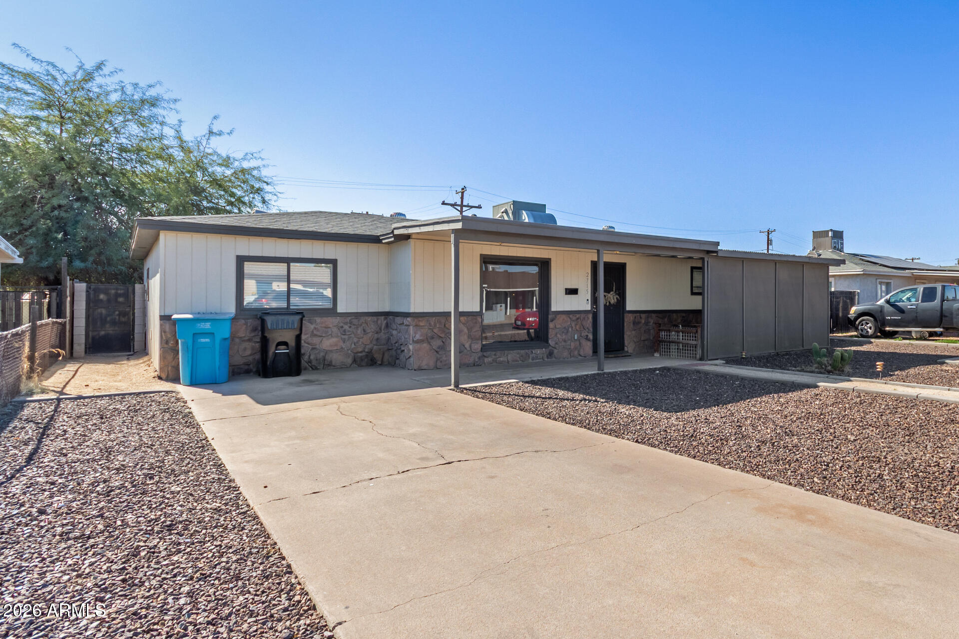 2715 West Royal Palm Road Phoenix, AZ 85051 - Photo 3 of 32 a view of a house with a patio